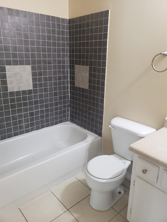 full bathroom featuring toilet, vanity, shower / bath combination, and tile patterned floors