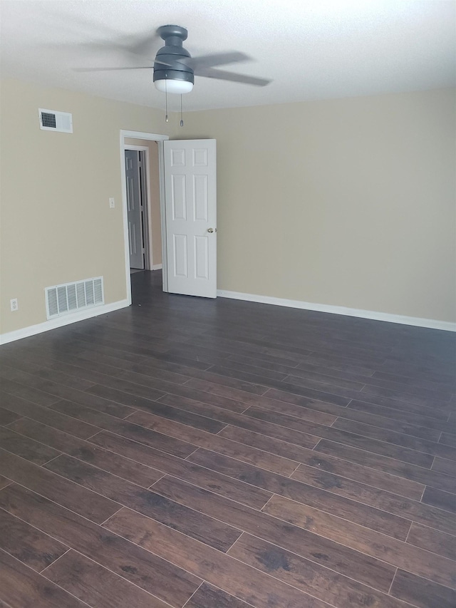 unfurnished room featuring dark hardwood / wood-style flooring and ceiling fan