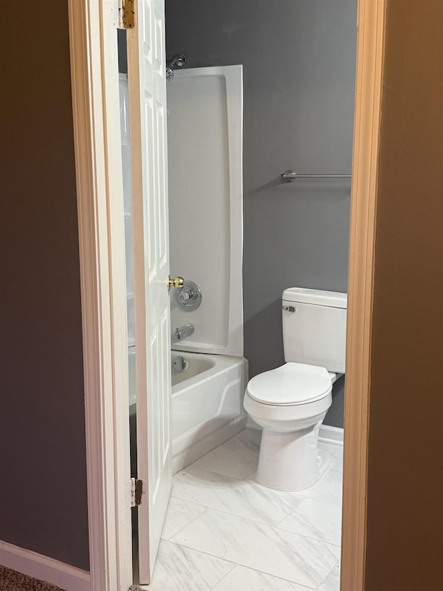 bathroom with toilet and shower / washtub combination