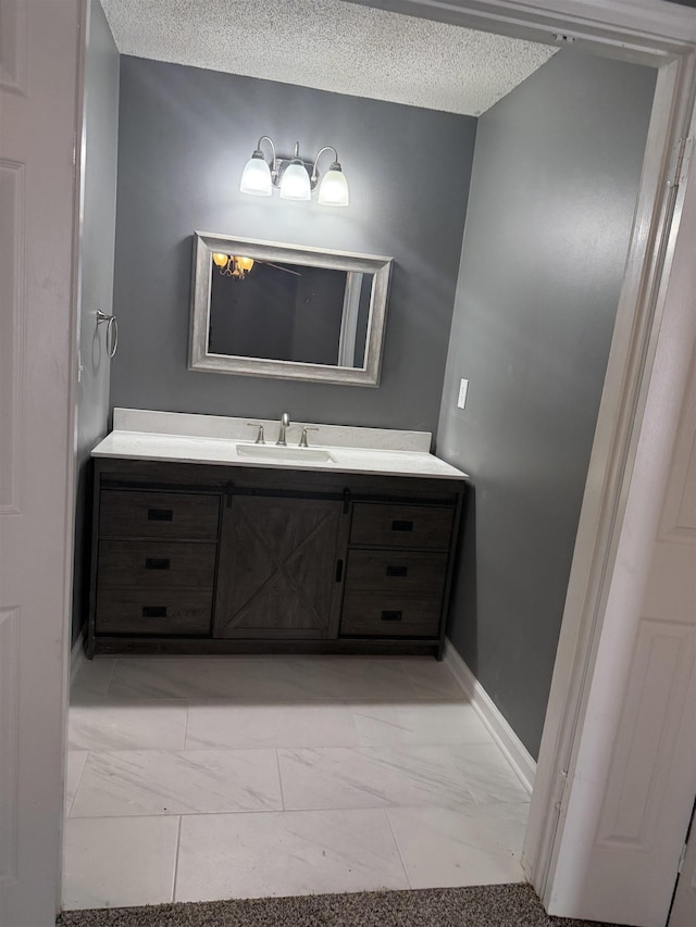 bathroom featuring vanity and a textured ceiling