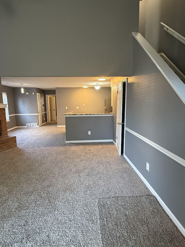 interior space with a fireplace and carpet