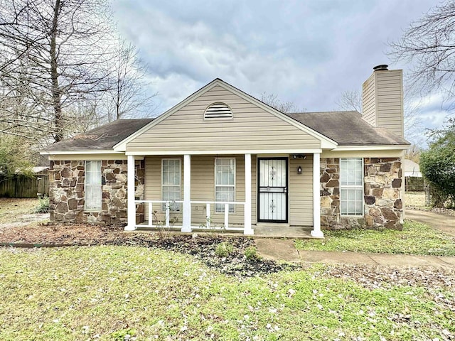 bungalow-style home featuring a front yard and a porch