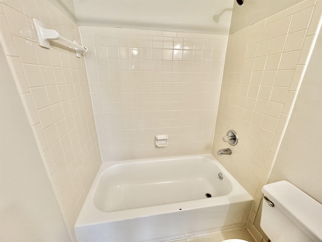 bathroom featuring shower / bath combination and toilet