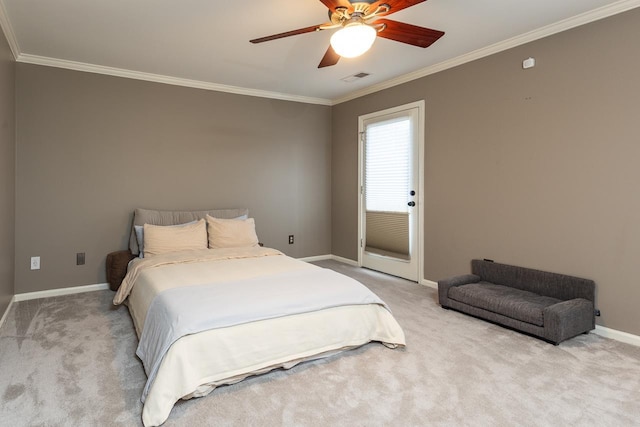 bedroom with ceiling fan, crown molding, and carpet floors