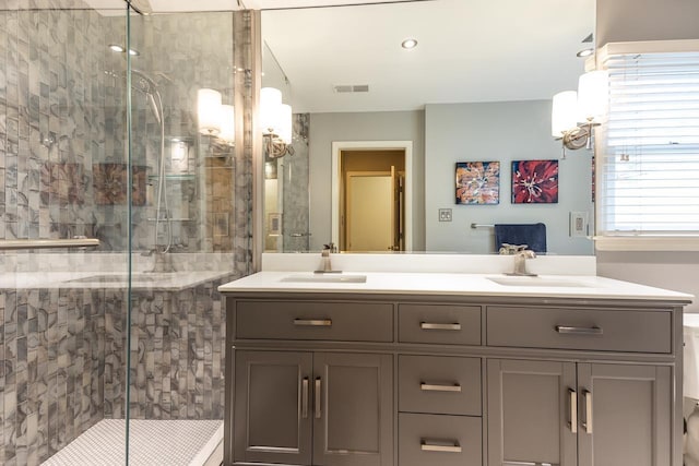 bathroom with vanity and walk in shower