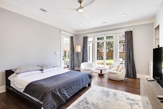 bedroom featuring ceiling fan, dark hardwood / wood-style floors, and ornamental molding