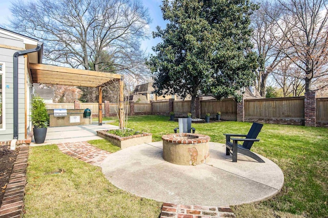 view of yard featuring a fire pit, area for grilling, a patio area, and a pergola