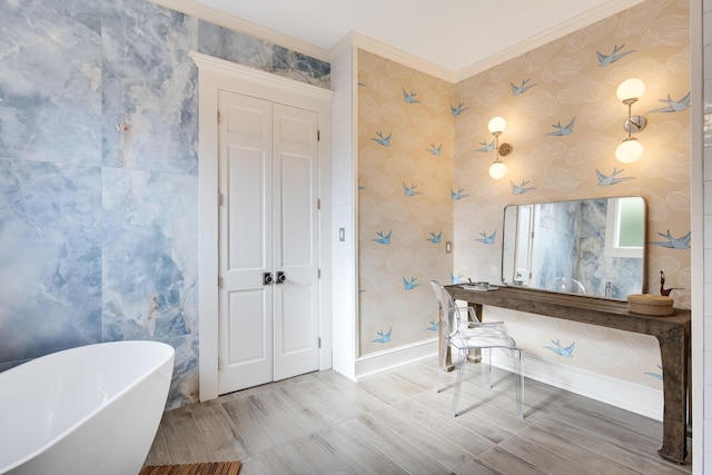 bathroom featuring a tub to relax in and ornamental molding