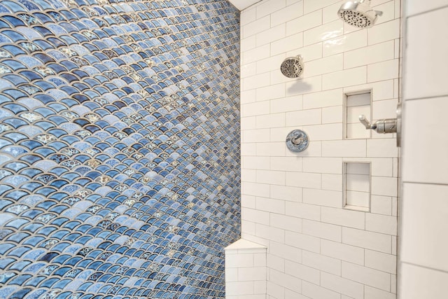 bathroom with a tile shower