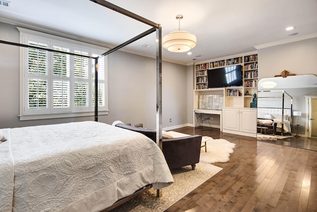 bedroom with crown molding and dark hardwood / wood-style floors