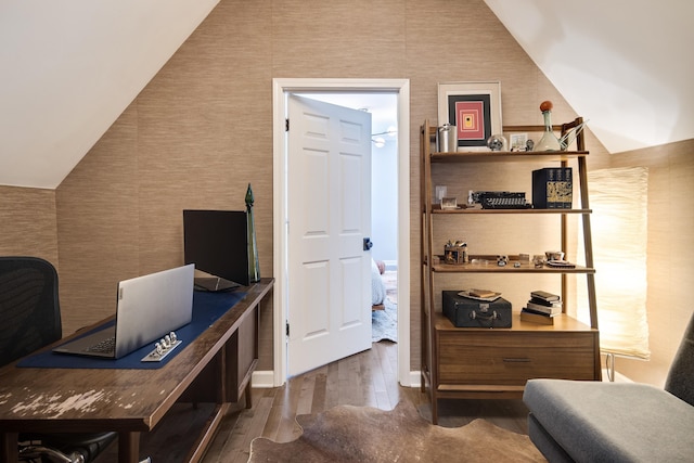 office with dark hardwood / wood-style floors and lofted ceiling