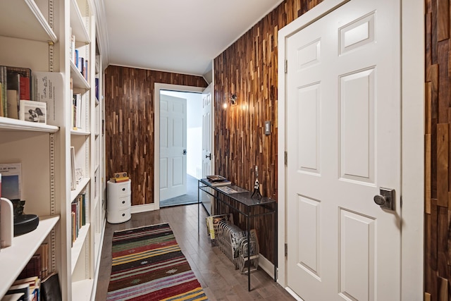 interior space with wooden walls and dark hardwood / wood-style floors