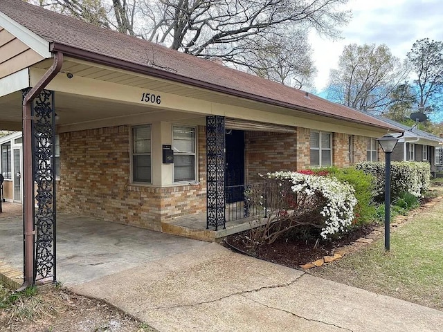 view of front facade with a carport