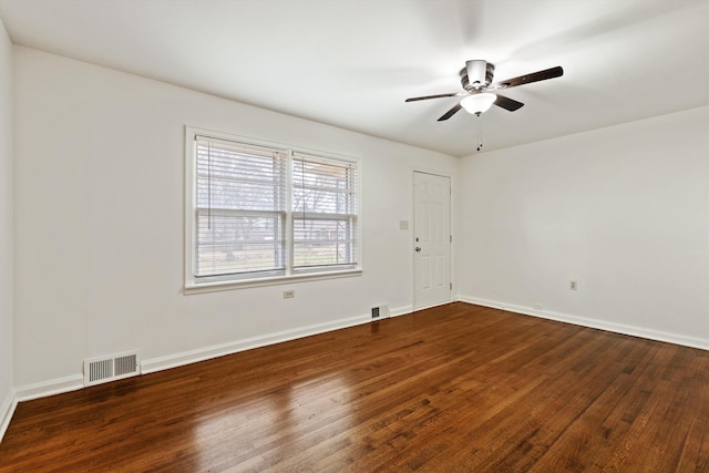 unfurnished room featuring dark hardwood / wood-style floors and ceiling fan