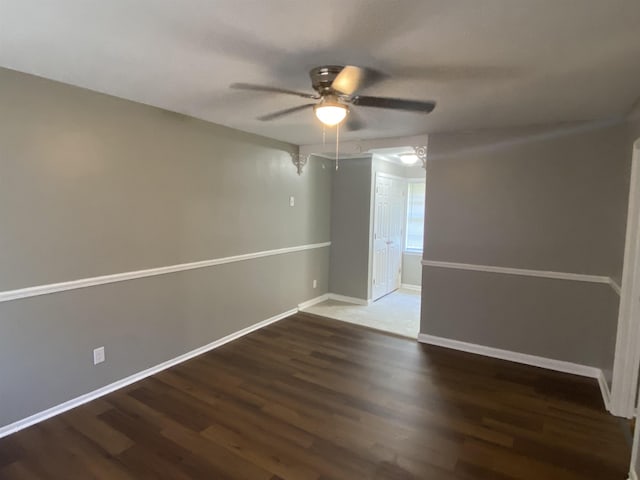 spare room featuring hardwood / wood-style floors and ceiling fan