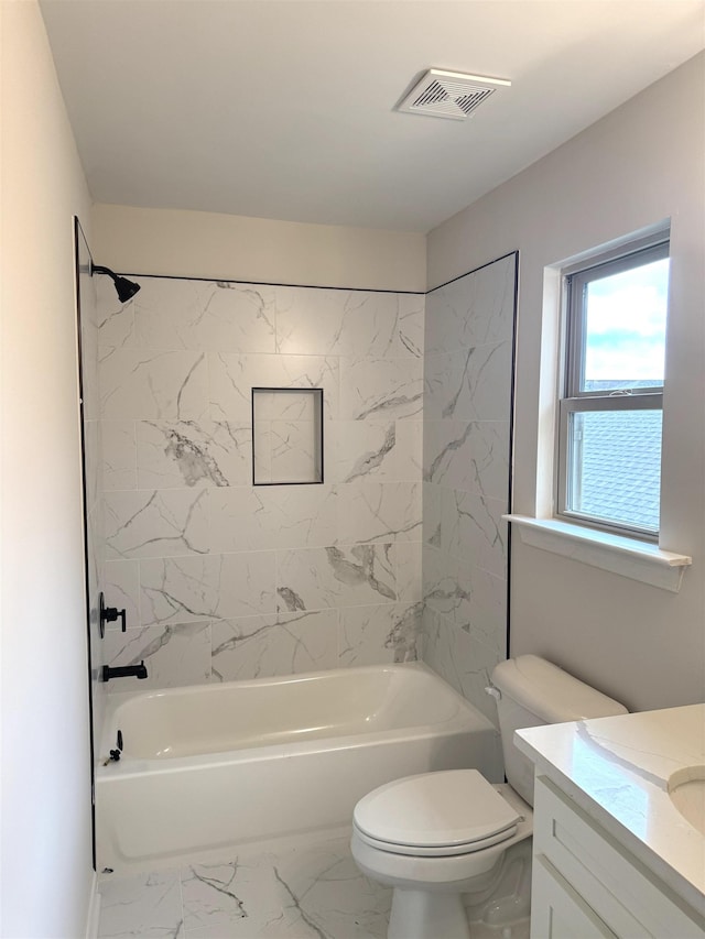 5549 Shipp Rd, Millington, TN 38053 - bathroom featuring vanity, toilet, marble finish floors, and washtub / shower combination