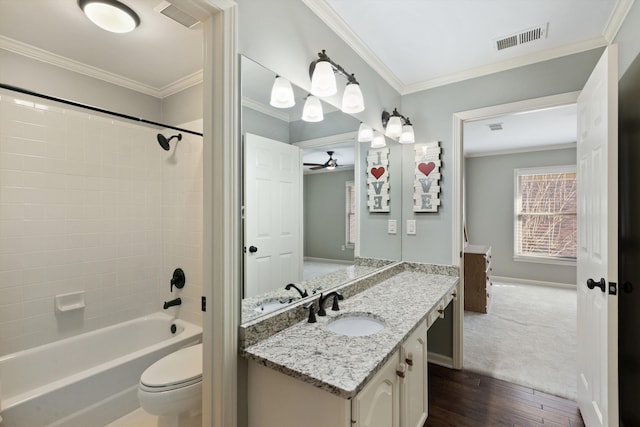 full bathroom with vanity, bathing tub / shower combination, hardwood / wood-style flooring, ceiling fan, and ornamental molding