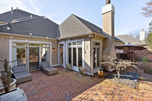 back of house with a patio