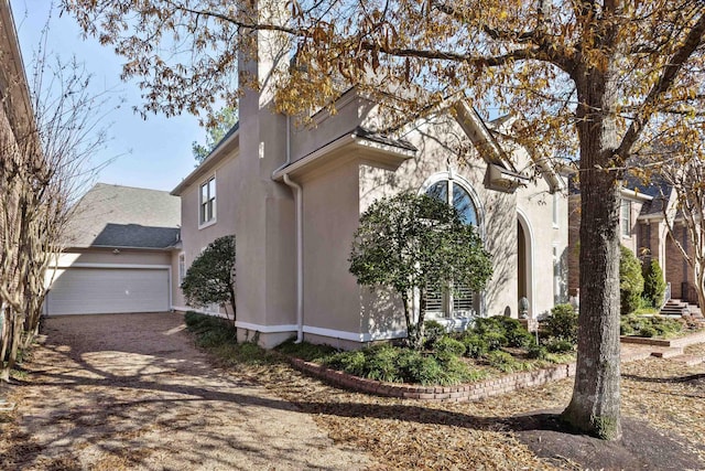 view of side of property with a garage