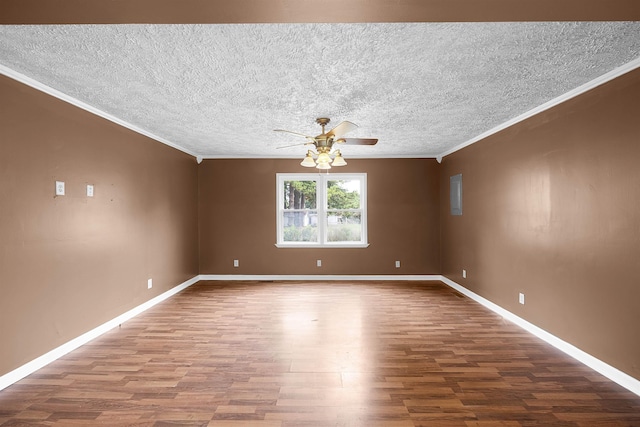 unfurnished room featuring hardwood / wood-style flooring, ceiling fan, and crown molding