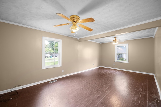 empty room with crown molding, ceiling fan, dark hardwood / wood-style floors, and a textured ceiling