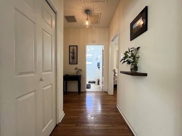 corridor featuring dark hardwood / wood-style floors