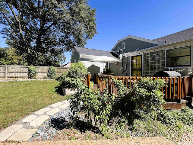 view of yard featuring a wooden deck