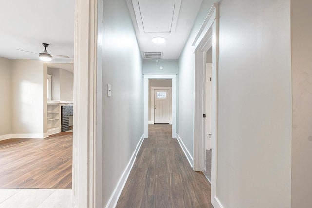 corridor with wood-type flooring