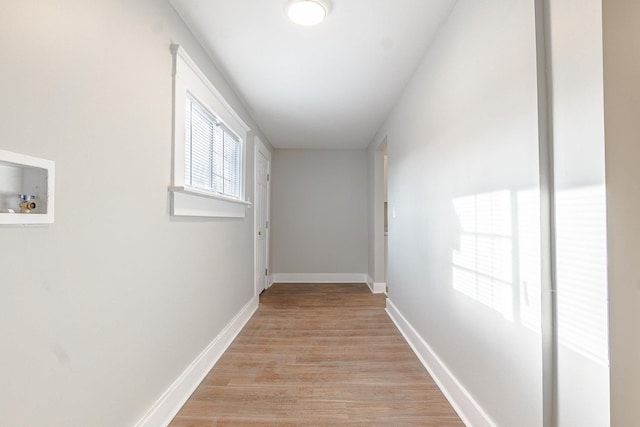 corridor featuring light hardwood / wood-style floors