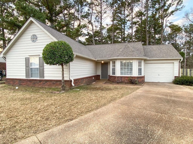 view of front of house featuring a front yard and a garage