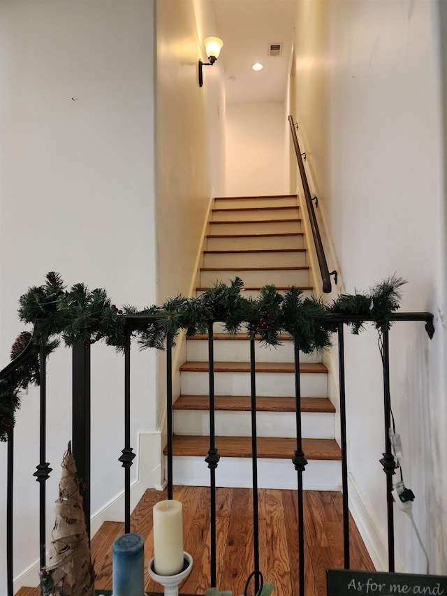 stairway with wood-type flooring