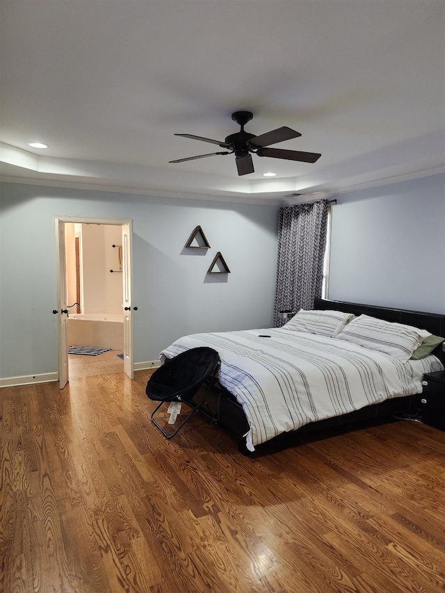 bedroom with ceiling fan and wood-type flooring