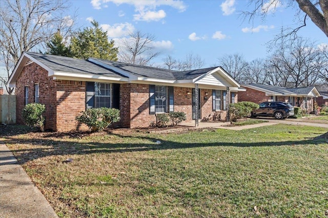 single story home with a front lawn