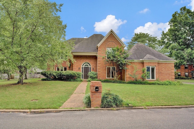 front facade with a front yard