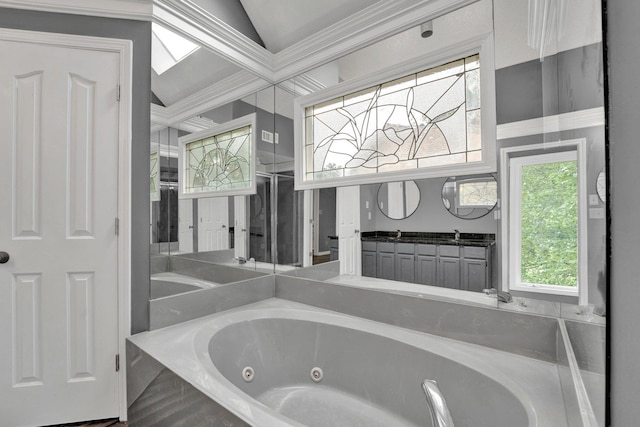 bathroom featuring tiled tub and sink