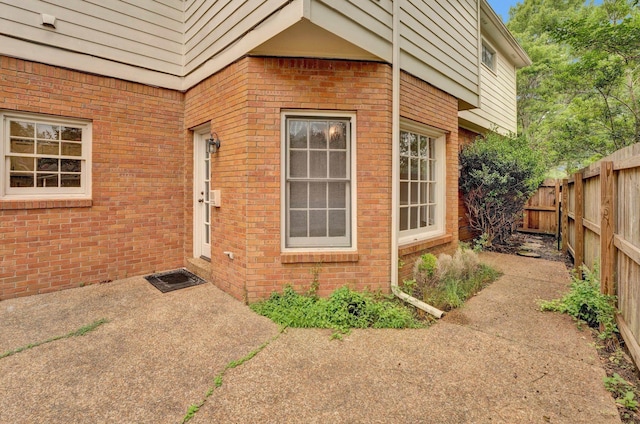 property entrance featuring a patio area