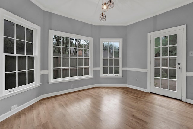 unfurnished sunroom with a notable chandelier