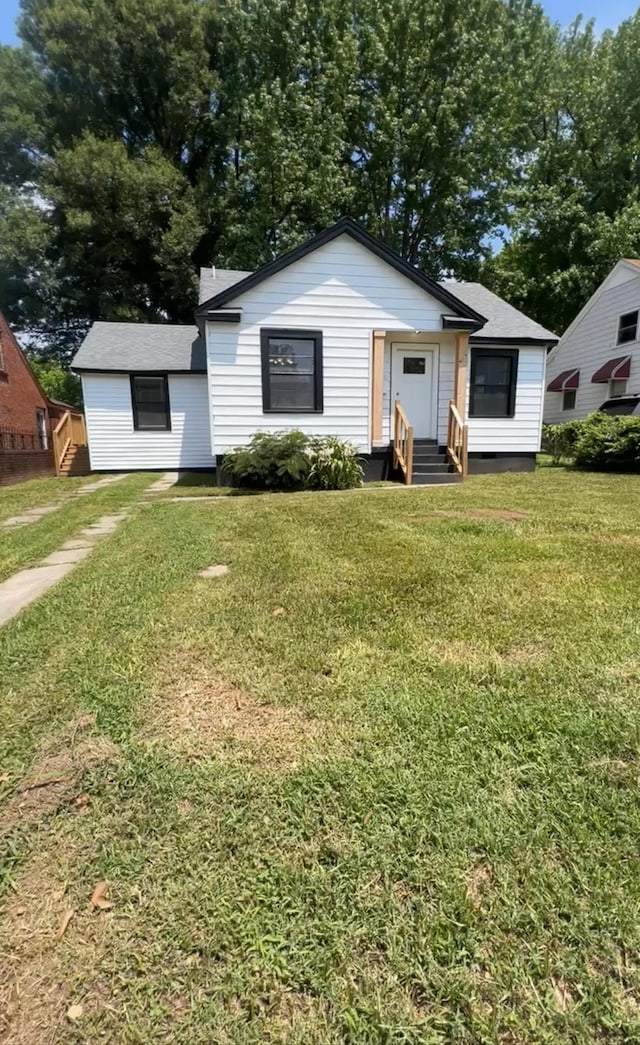 view of front of home with a front lawn