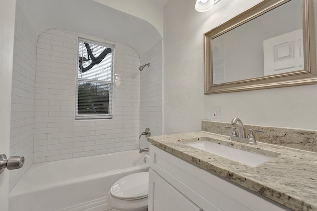 full bathroom featuring vanity, toilet, and tiled shower / bath