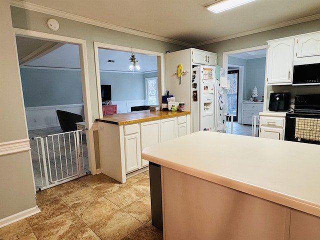 kitchen featuring white cabinets, electric range, white refrigerator with ice dispenser, and hanging light fixtures