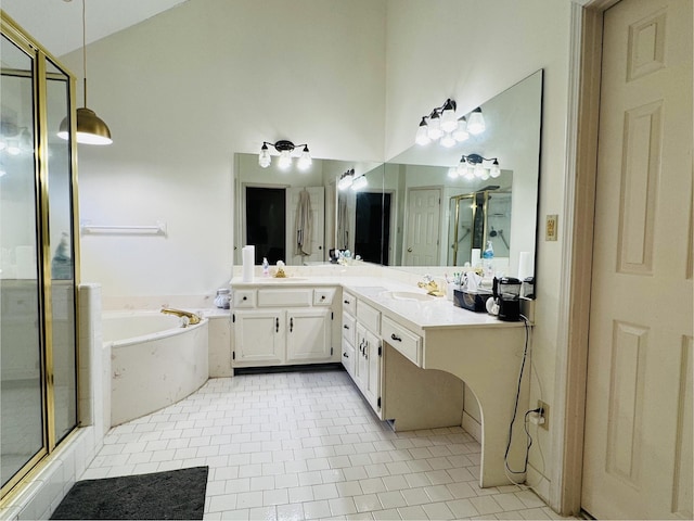 bathroom featuring tile patterned flooring, vanity, and plus walk in shower