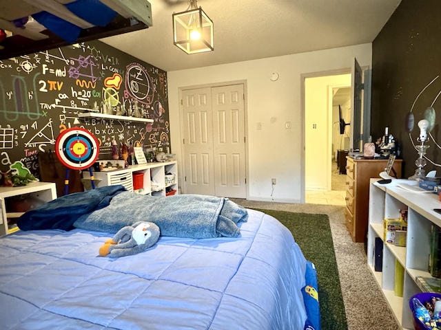 bedroom with carpet floors and a closet