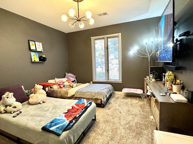 bedroom with carpet flooring, a textured ceiling, and an inviting chandelier