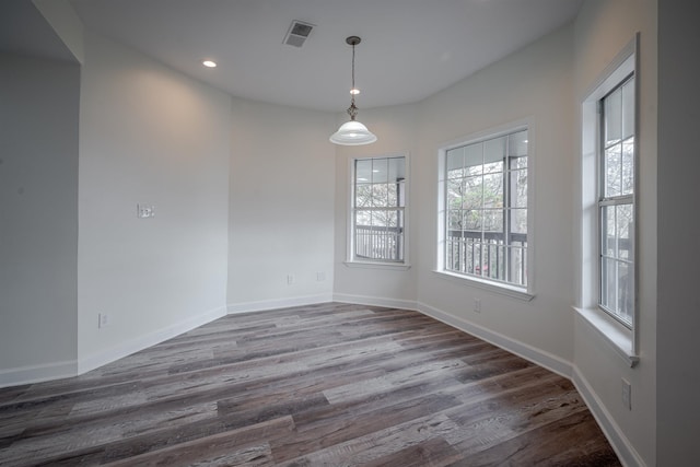 unfurnished room featuring dark hardwood / wood-style floors