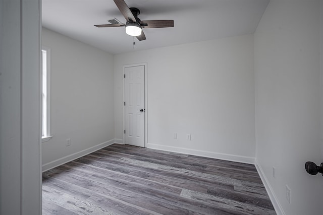 unfurnished room featuring ceiling fan and hardwood / wood-style flooring