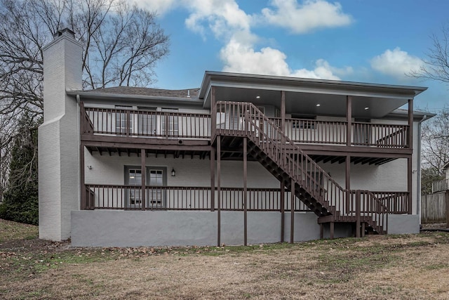 back of house featuring a deck