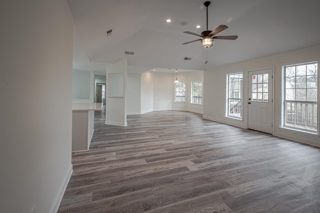 unfurnished living room with ceiling fan and dark hardwood / wood-style floors