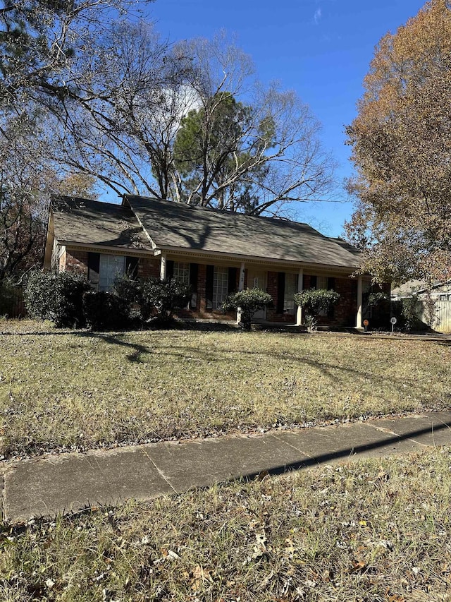 ranch-style house with a front lawn