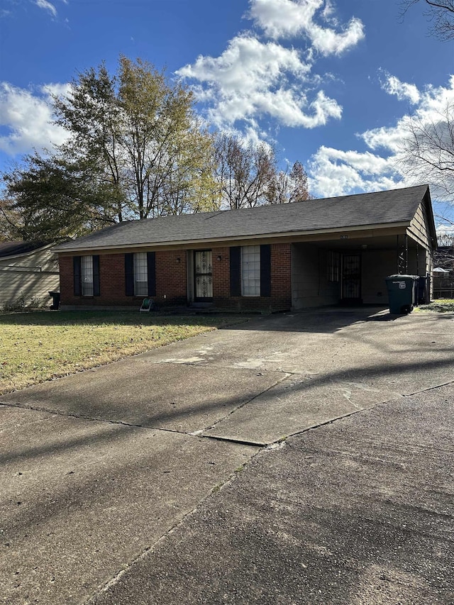 single story home featuring a front yard and a carport