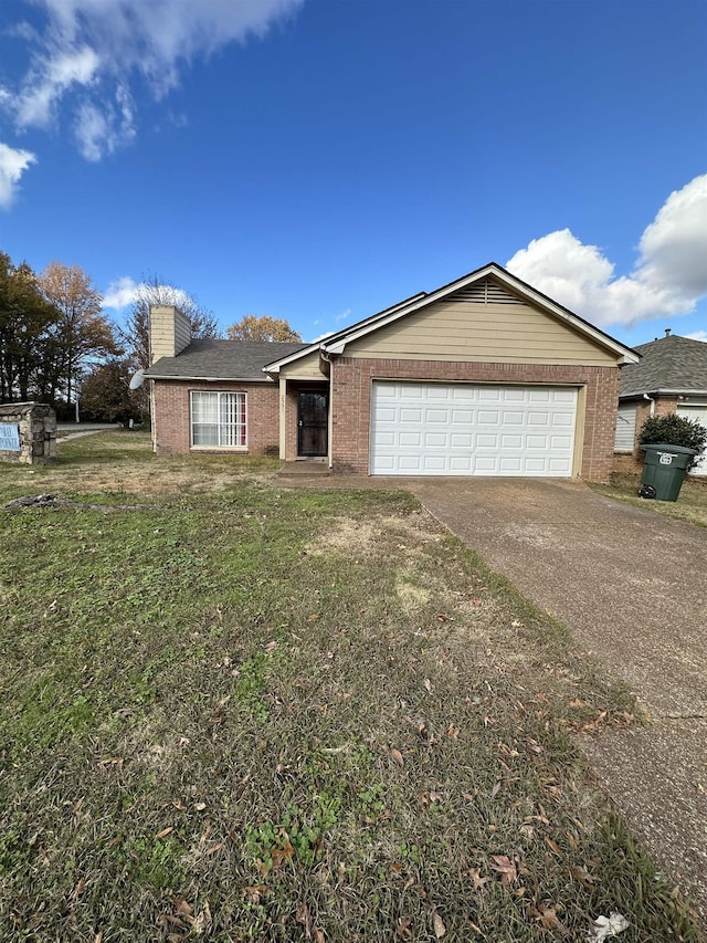 single story home featuring a garage and a front lawn